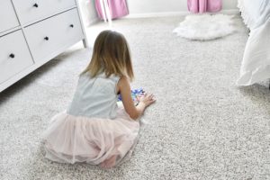 Toddler Girl Playing on Carpet